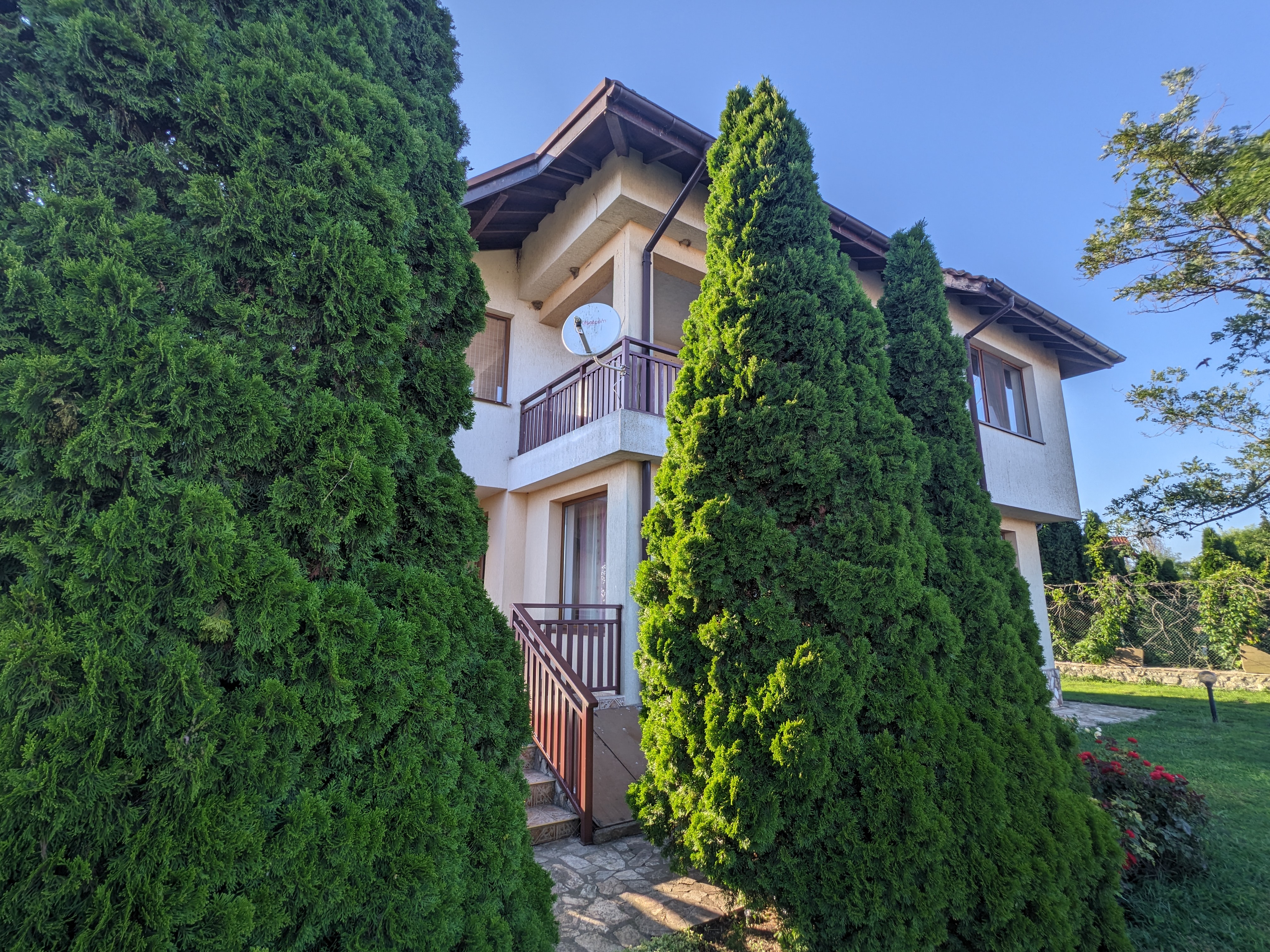 House nestled in trees
